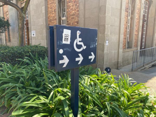A disability access sign on Wits campus that represent physical disability. Photo: Khutso Ngwatoana